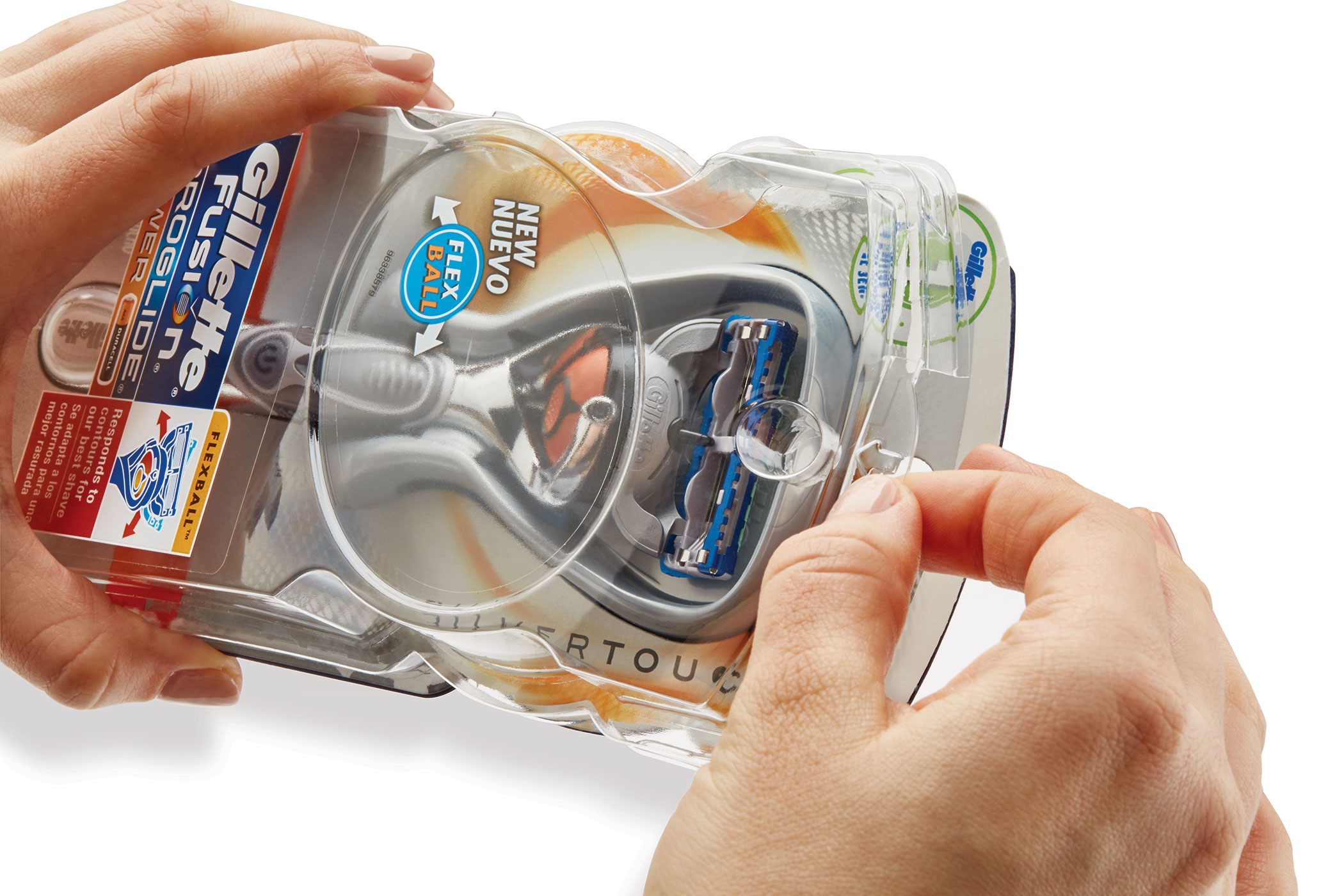Hands opening a package containing a Gillette Fusion ProGlide razor with FlexBall technology