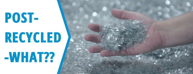POST-RECYCLED-WHAT?? A hand holding shredded recycled material