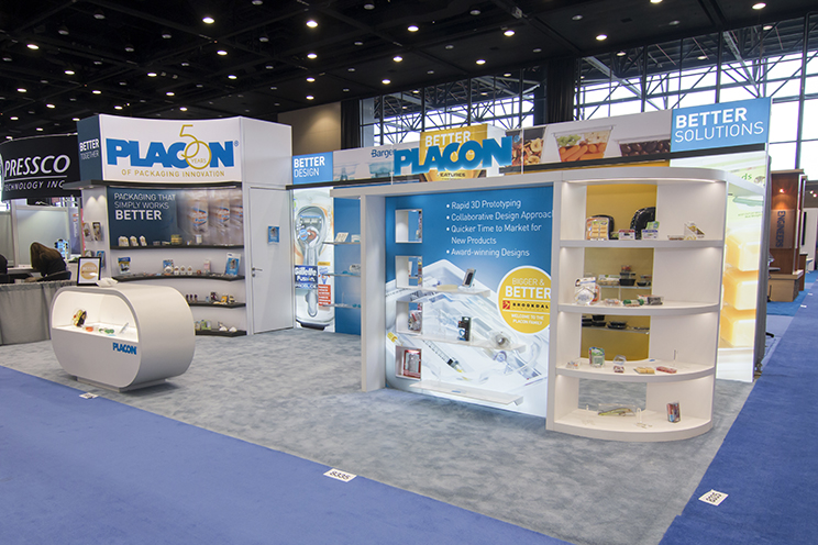 Trade show booth displaying packaging products and prototypes, branded Placon and Better Solutions