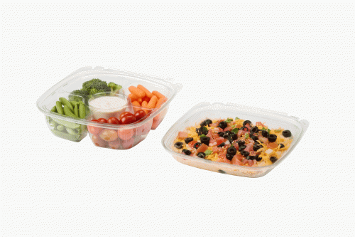 Two clear containers of prepared food: mixed vegetables and a baked dish topped with olives and cheese