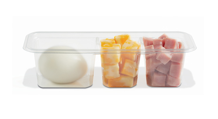 Three-compartment container holding a peeled onion, cubed cheddar cheese, and diced ham